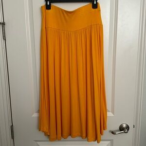 Loft gold rayon/ spandex long skirt. Size medium.